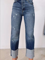 High waist distressed straight leg jeans from Trendsi, showing fitted denim with ripped details and classic five-pocket design.