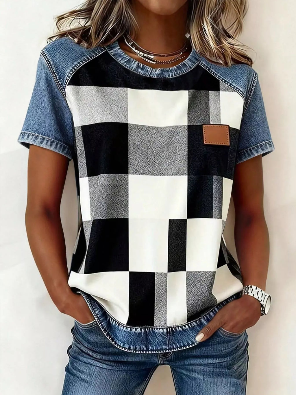 Denim patchwork short sleeve blouse by Plush Fashion Hub, featuring mixed denim patches and casual relaxed fit.