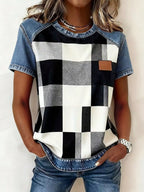 Denim patchwork short sleeve blouse by Plush Fashion Hub, featuring mixed denim patches and casual relaxed fit.