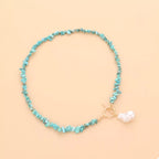 Turquoise irregular pearl necklace featuring unique, natural-shaped pearls on a delicate chain, by Shopimist.