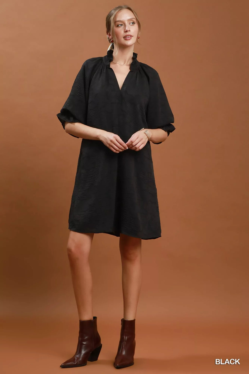 Umgee floral textured jacquard V-neck dress with a relaxed fit, showcasing a colorful floral pattern and soft fabric.