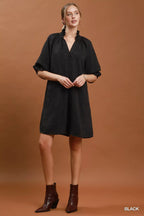 Umgee floral textured jacquard V-neck dress with a relaxed fit, showcasing a colorful floral pattern and soft fabric.