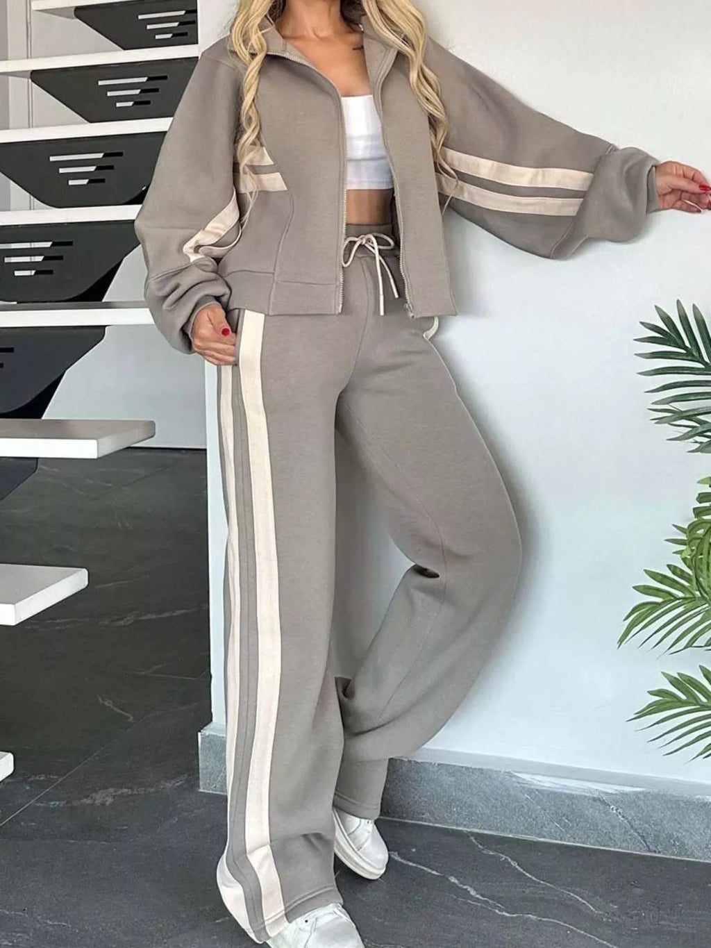 Plus size contrast stripe zip-up activewear jacket and pants set by Plush Fashion Hub, shown on a model.