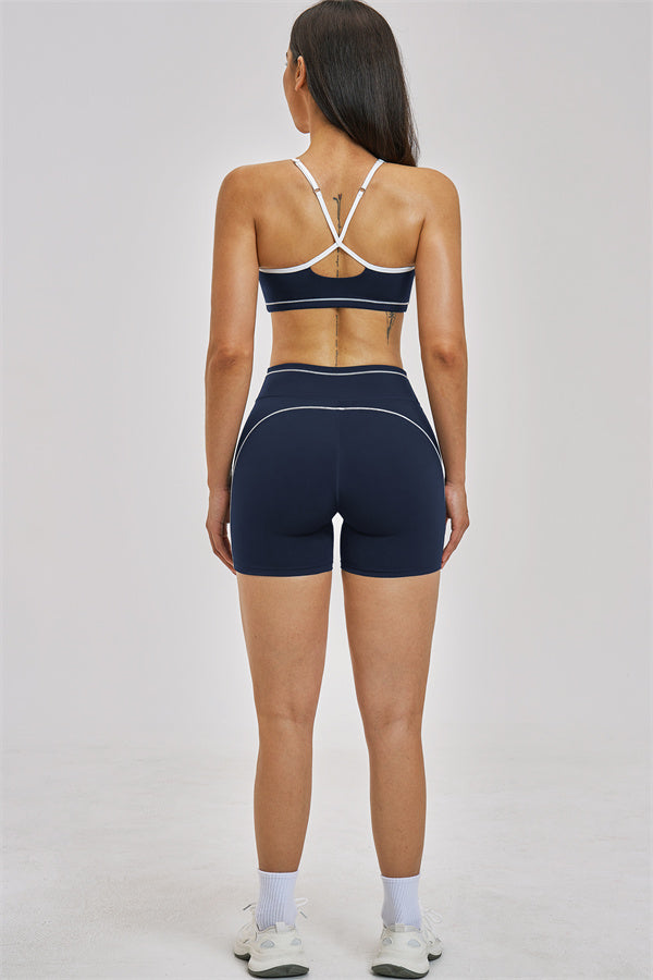 Fitglutes Activewear sports bra and shorts 2-piece set, athletic workout clothes, breathable fabric, close-up of black gymwear ensemble.