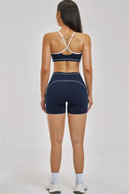 Fitglutes Activewear sports bra and shorts 2-piece set, athletic workout clothes, breathable fabric, close-up of black gymwear ensemble.