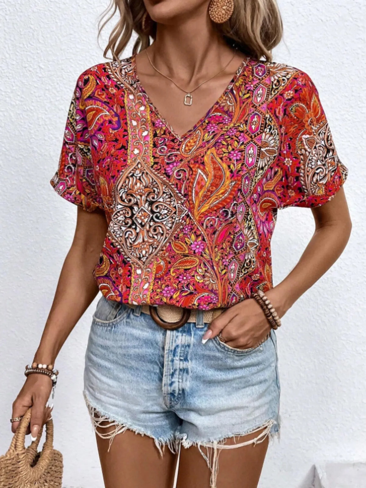Bohemian paisley V-neck short sleeve T-shirt by Plush Fashion Hub featuring colorful paisley pattern and relaxed fit.