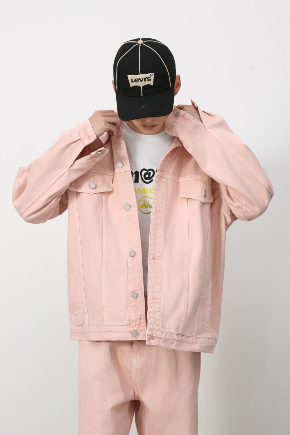 Men's dropped shoulder denim jacket by Plush Fashion Hub, featuring button-up front and casual style, displayed on a hanger.