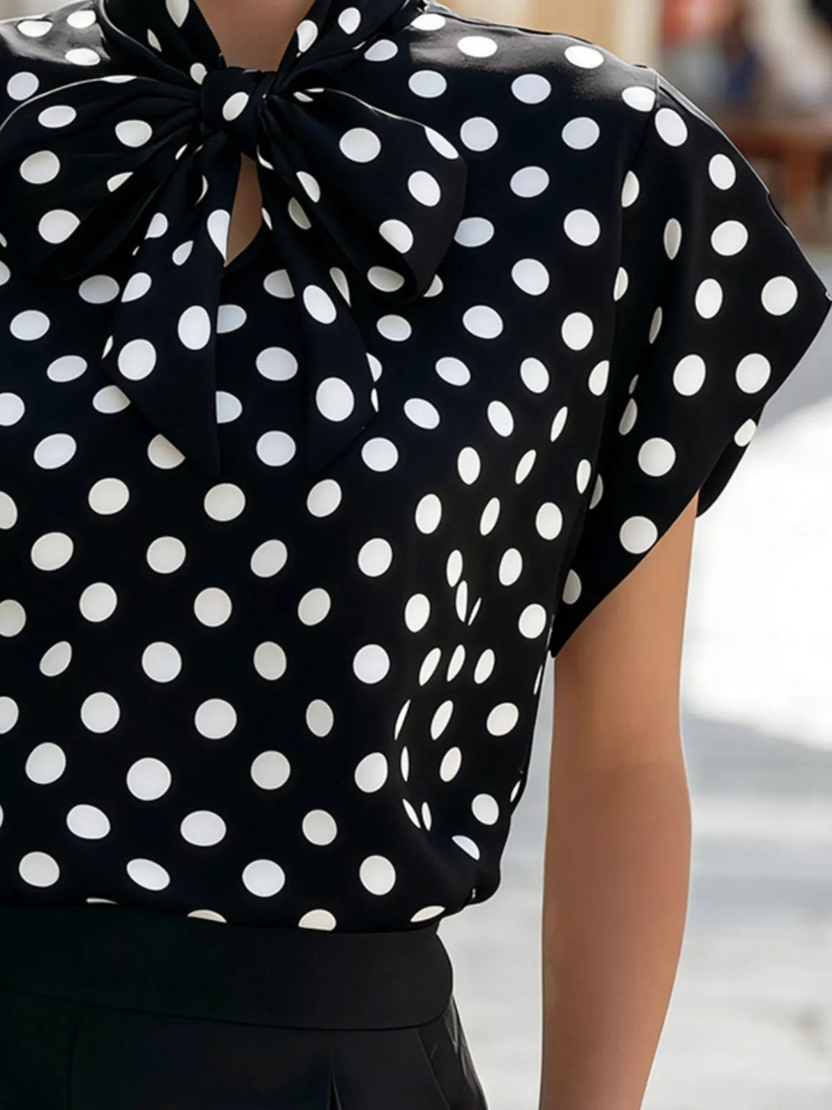 Polka dot tie neck blouse from Plush Fashion Hub, stylish women's top with a tie detail and classic polka dot pattern.