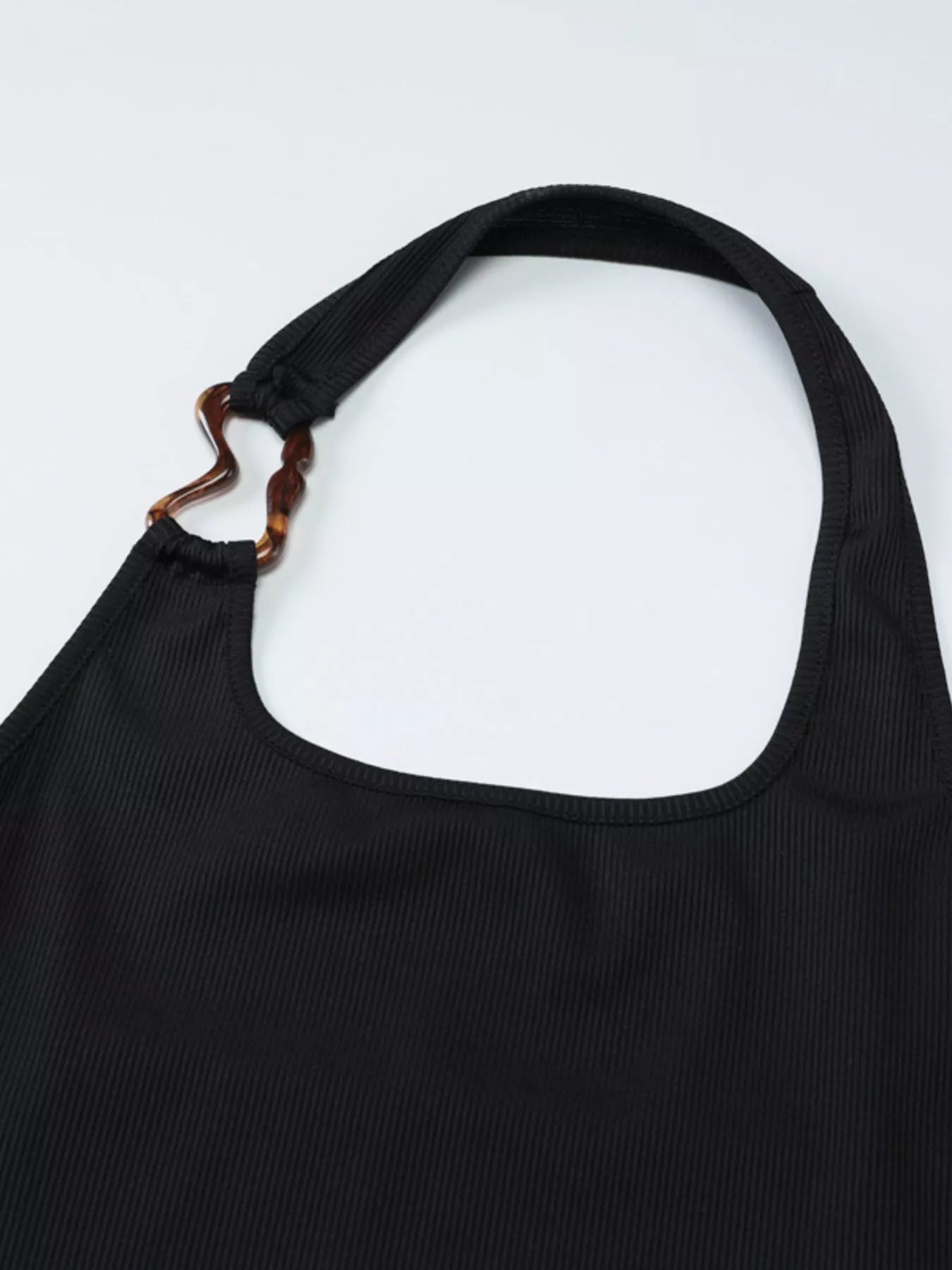 Ribbed black halter neck tank top from Shopimist, close-up of fabric and neckline detail on a mannequin.