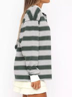 Striped long sleeve polo shirt with button details from Trendsi, featuring a classic design and comfortable fit.