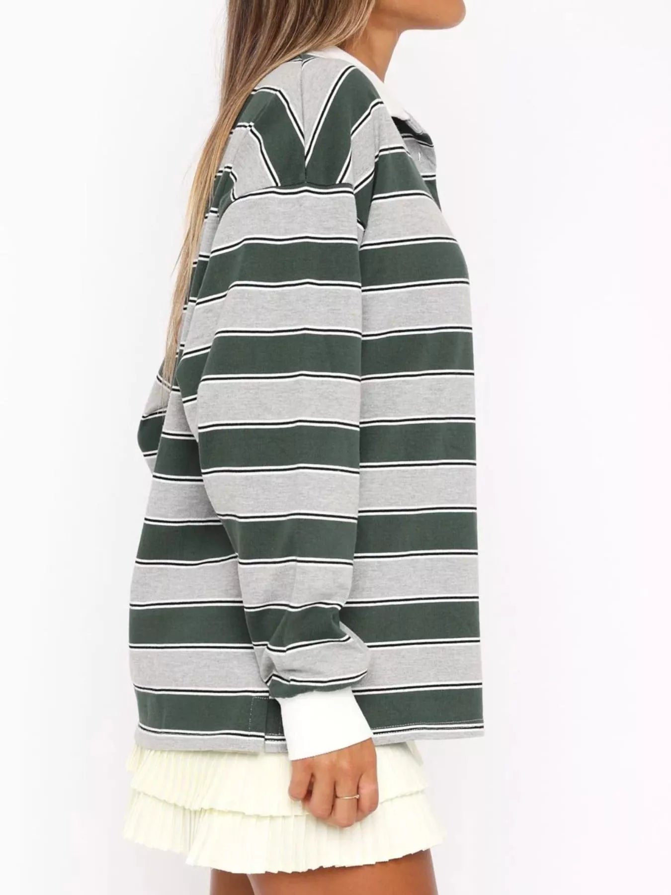 Striped long sleeve polo shirt with button details from Trendsi, featuring a classic design and comfortable fit.