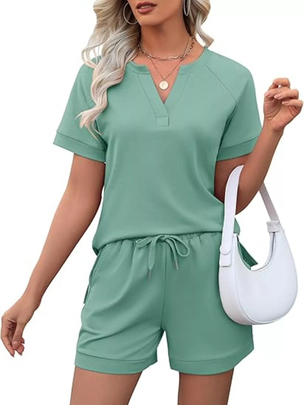 Solid color short sleeve top and shorts two-piece set from Trendsi, featuring a casual, comfortable design.