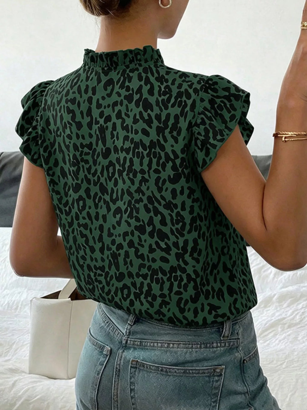 Leopard print ruffle sleeve blouse by Plush Fashion Hub, stylish women's blouse with bold animal print and feminine ruffle details.