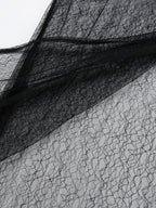 Women's elegant lace midi skirt with sheer split detail, stylish and sophisticated fashion by Trendsi.