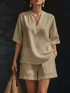 Plus size Trendsi notched half sleeve top and shorts set, featuring a stylish coordinated look with a comfortable fit.