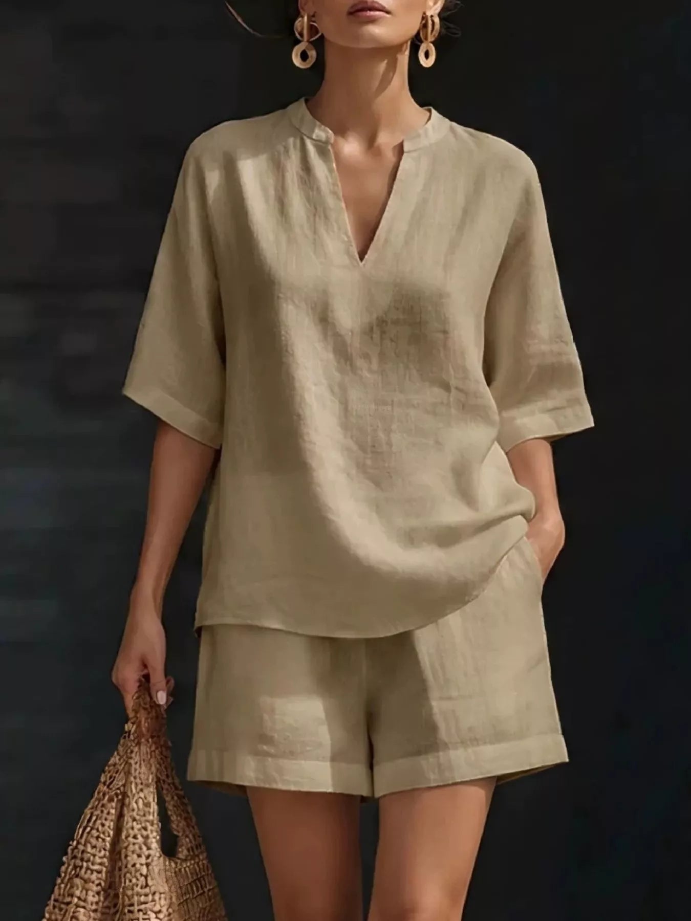 Plus size Trendsi notched half sleeve top and shorts set, featuring a stylish coordinated look with a comfortable fit.