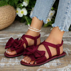 Shopimist bow embellished flat sandals with sleek design and decorative bows on the straps, perfect for casual summer wear.