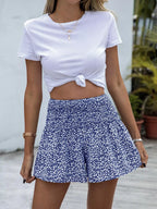 Floral print elastic waist shorts by Trendsi, featuring a vibrant floral pattern and comfortable fit, perfect for casual summer wear.