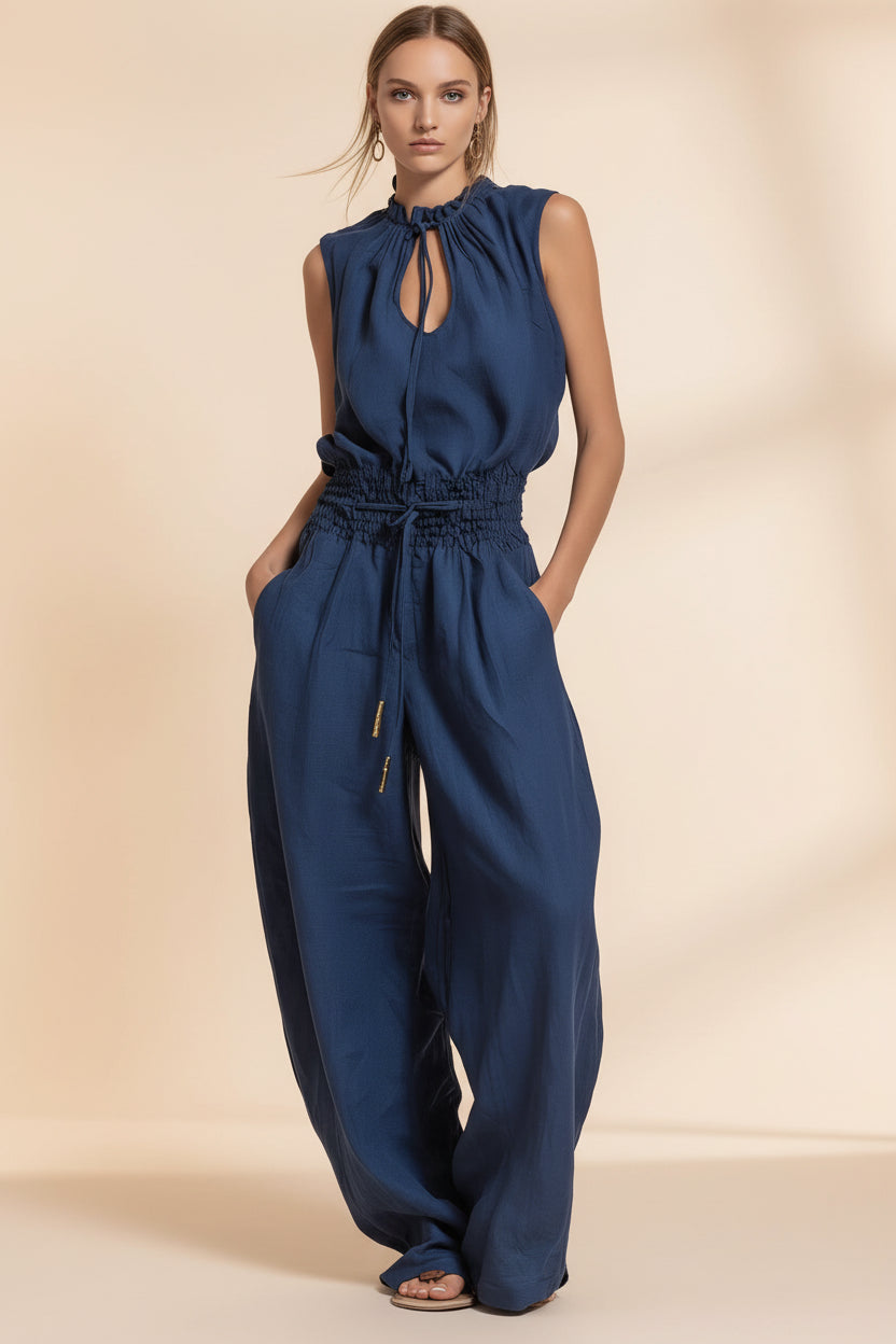 Women's sleeveless high-waist wide-leg pleated jumpsuit by Plush Fashion Hub, shown in a casualwear style with a relaxed fit.