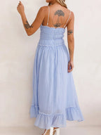 Elegant women's midi dress featuring ruffled hem and cami style by Trendsi, perfect for sophisticated occasions.