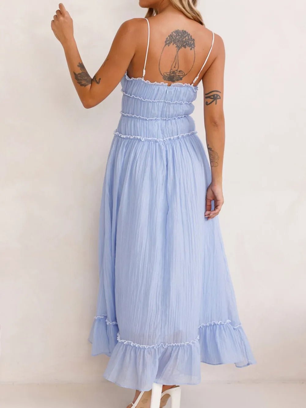 Elegant women's midi dress featuring ruffled hem and cami style by Trendsi, perfect for sophisticated occasions.