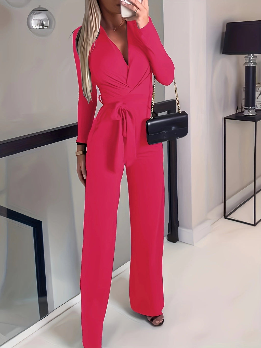 Women's solid V-neck bow tie waist slimming casual jumpsuit by FitiqueFit, showing the stylish V-neck and bow detail at the waist.