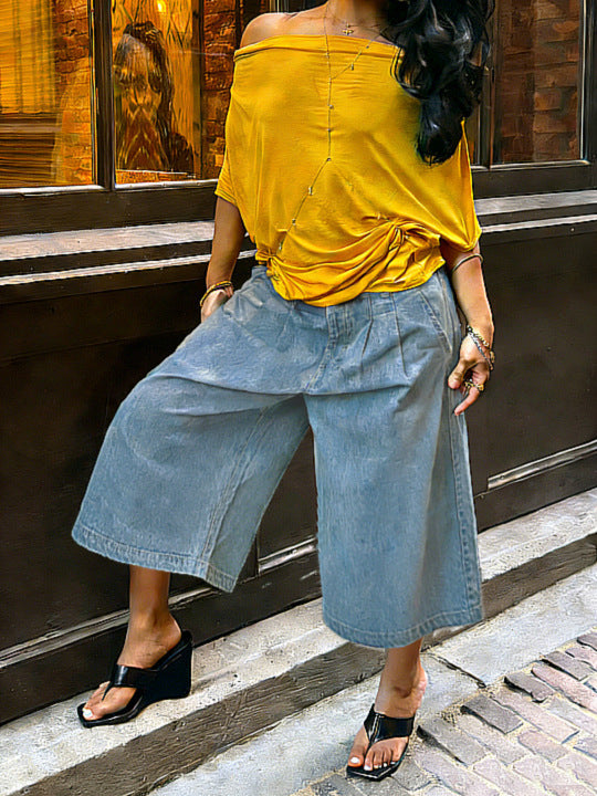 Women's wide-leg cargo pants by Plush Fashion Hub featuring zipper and button details, casual and stylish for everyday wear.