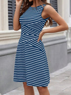 Shopimist round neck sleeveless dress with a flowing fabric, perfect for casual summer wear.