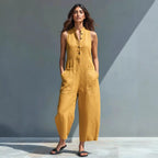 Light blue summer sleeveless jumpsuit with V-neck, pockets, buttons, and casual trousers for women, by Plush Fashion Hub.
