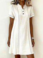 Women's printed button-up midi dress with stand collar, 3/4 sleeves, loose fit by Plush Fashion Hub, stylish and comfortable.