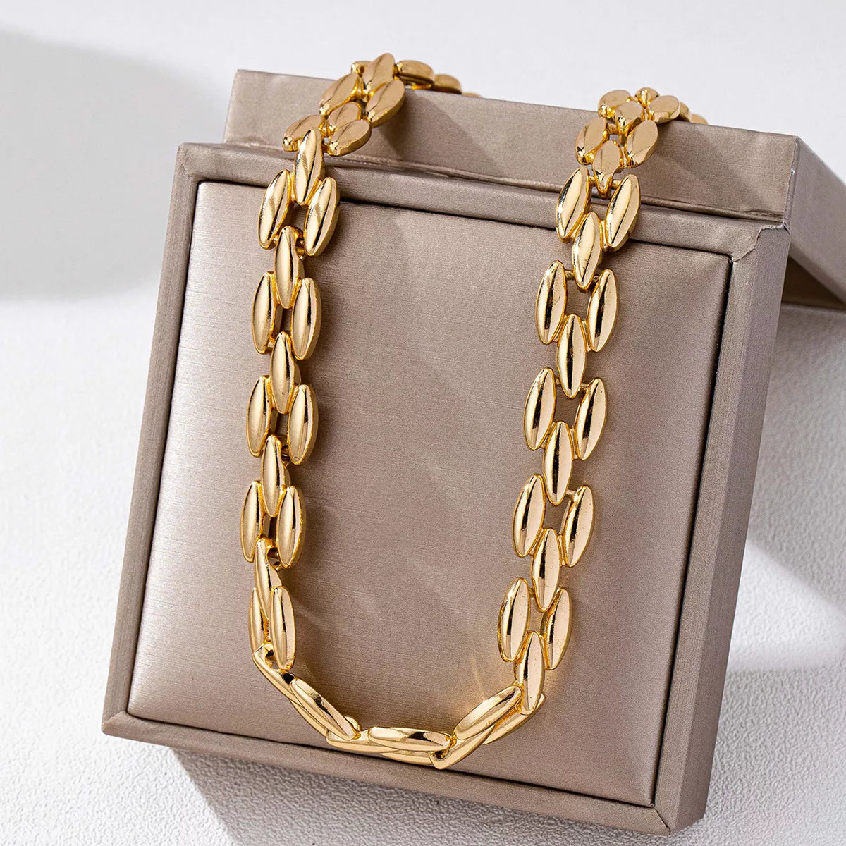 Gold-plated chunky necklace from Plush Fashion Hub featuring bold, layered 18K gold finish on a stylish chain.