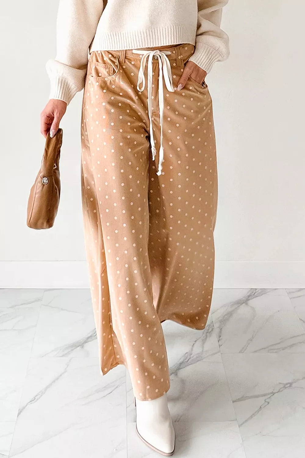 Women's polka dot wide-leg drawstring dress pants by Trendsi, lightweight casual trousers with a relaxed fit and stylish pattern.