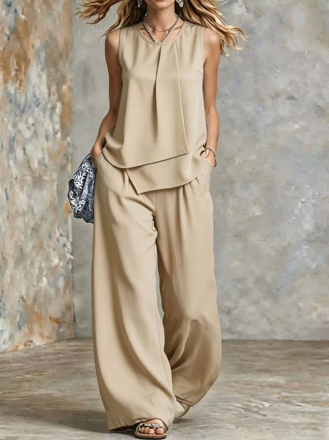 Women's sleeveless two-piece set with solid color wide-leg pants and top from Plush Fashion Hub, displayed on a hanger.