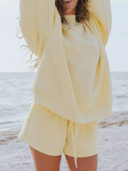 Relaxed fit round neck sweatshirt and shorts set by Plush Fashion Hub, showing the comfortable, casual 2-piece loungewear in soft fabric.