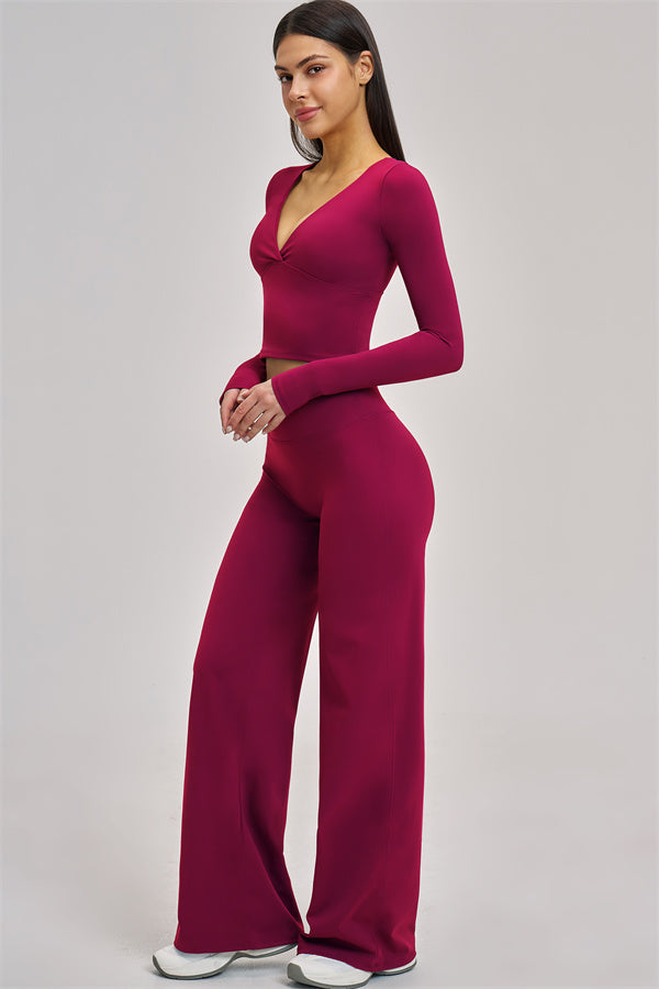 Fitglutes Activewear long sleeve crop top from The Swoon collection, shown in black with a fitted design and crew neckline.