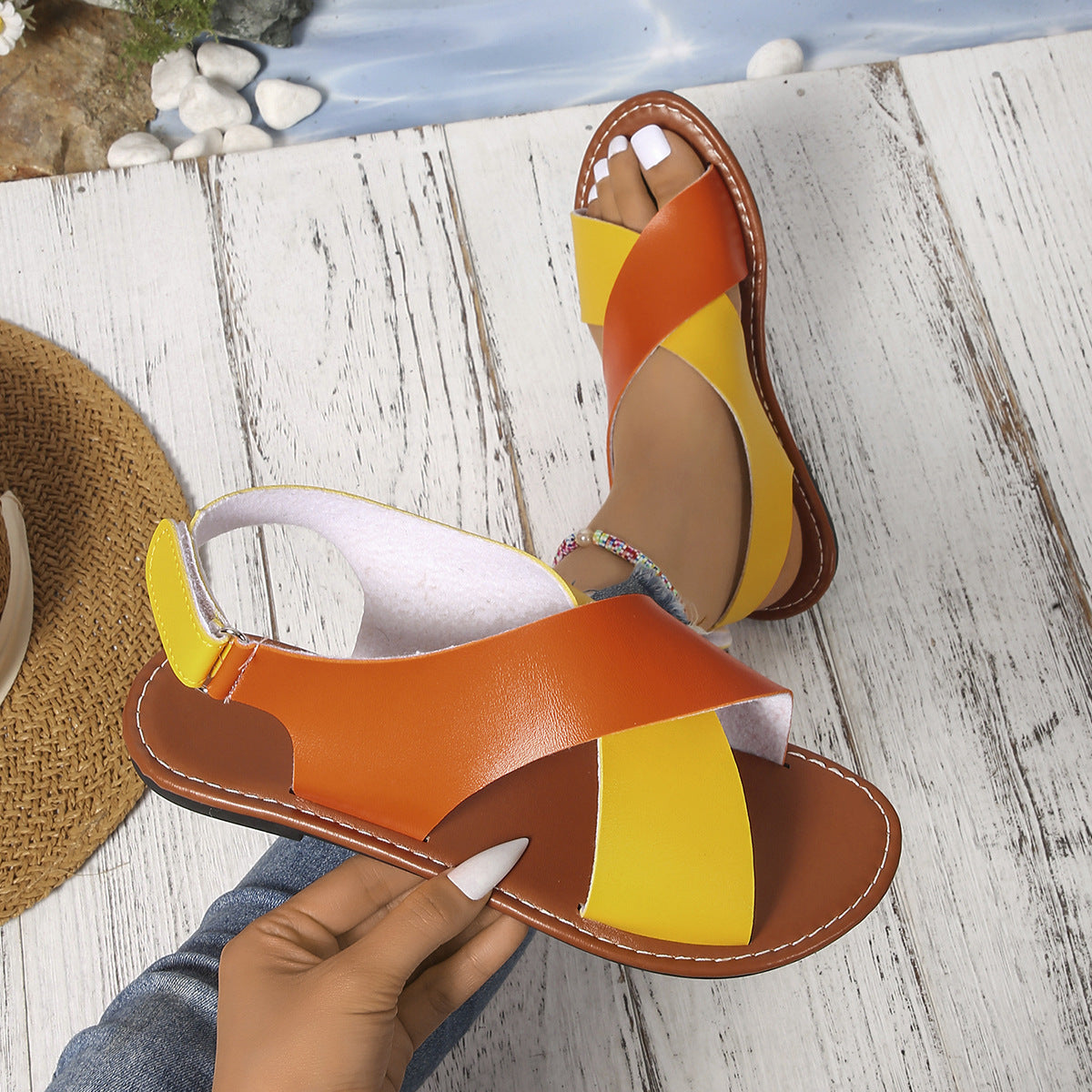 Women's color-block cross-strap flat sandals by FitiqueFit, featuring vibrant straps and comfortable flat sole.