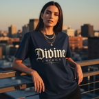 Navy Divine Energy T-Shirt by Wear Your Worship featuring Gothic script faith graphic, worn by a female model in a lifestyle setting.