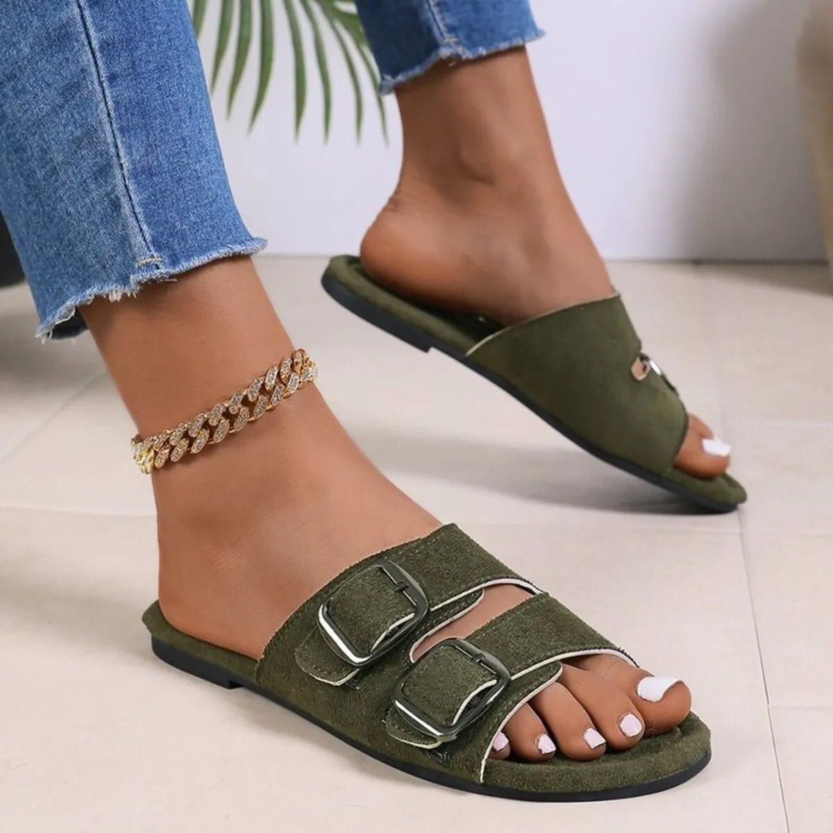 Women's double buckle PU leather flat slide sandals by Trendsi, featuring comfortable casual footwear design and sleek style.