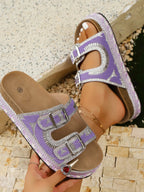 Faux leather platform sandals with double buckles and rhinestone accents, trendy shoe by Trendsi featuring a chunky heel.