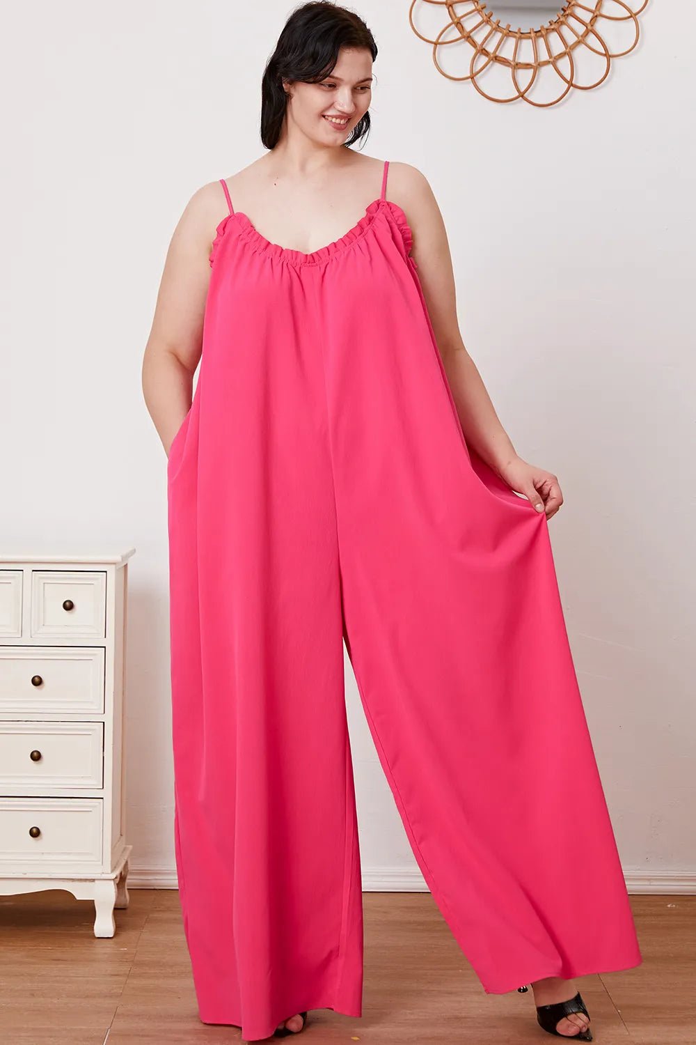 Women's ruffle trim tie-back cami jumpsuit with pockets, featuring a stylish design, lightweight fabric, and adjustable tie-back detail.