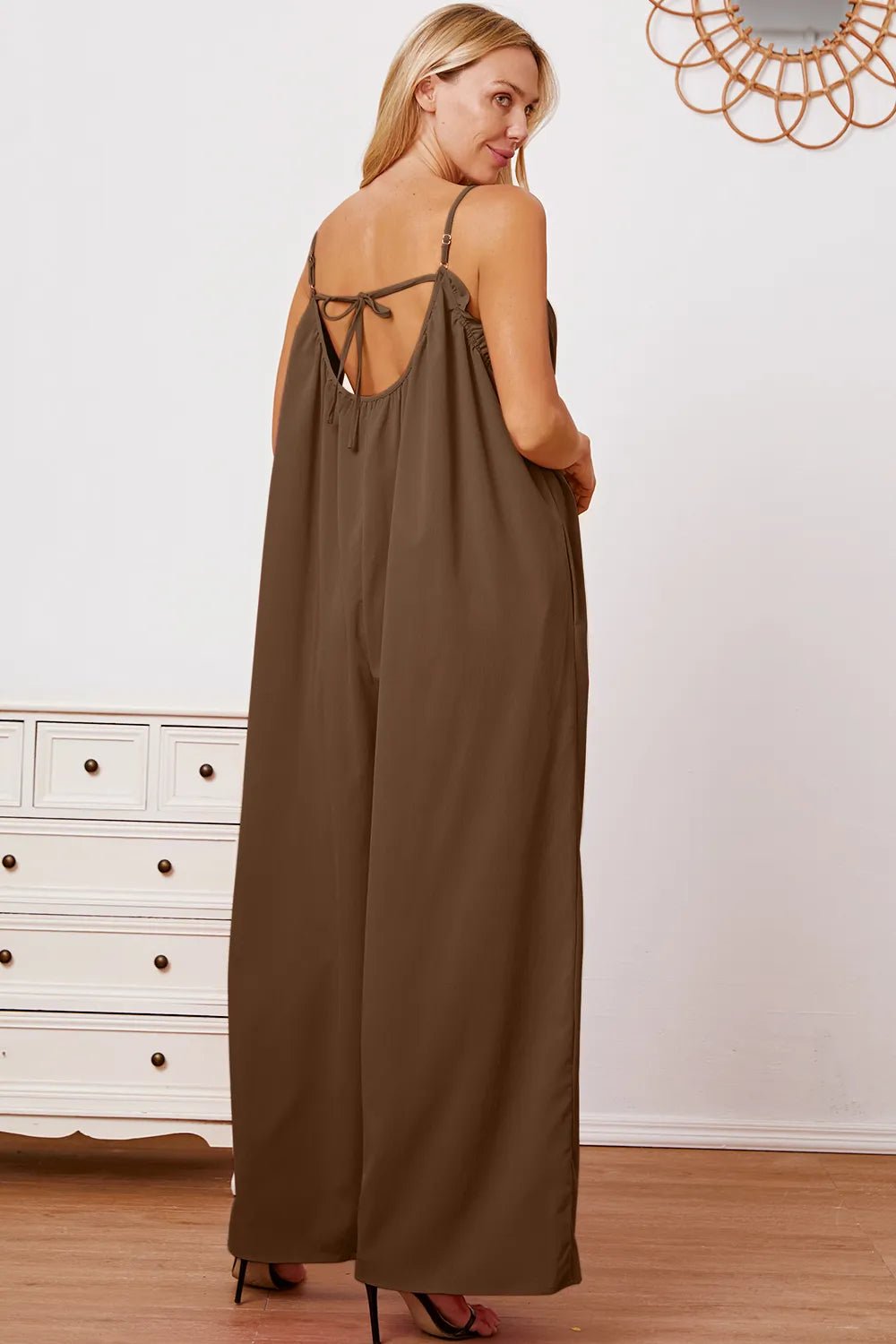 Women's ruffle trim tie-back cami jumpsuit with pockets, stylish women's apparel by Trendsi, shown in full length.