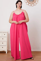Women's ruffle trim tie-back cami jumpsuit with pockets, trendy women's apparel by Trendsi, shown with ruffle details and waist tie.