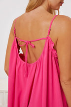 Women’s ruffle trim tie-back cami jumpsuit with pockets, stylish and comfortable women’s apparel featuring a flattering fit.