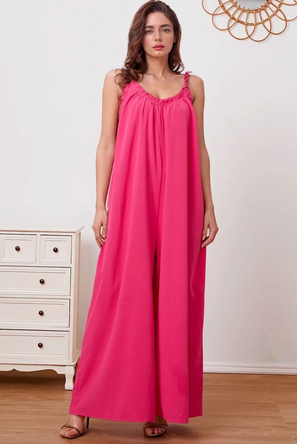 Women's ruffle trim tie-back cami jumpsuit with pockets, stylish trendy women's apparel featuring a sleeveless design and flattering fit.