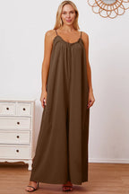 Women's ruffle trim tie-back cami jumpsuit with pockets, stylish women's apparel by Trendsi, featuring a flattering fit and elegant design.