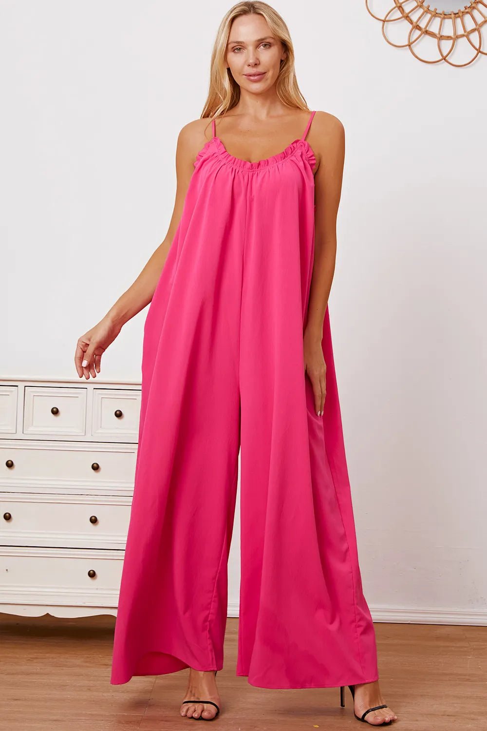 Women's ruffle trim tie-back cami jumpsuit with pockets, stylish women's apparel by Trendsi, featuring ruffle details and a relaxed fit.