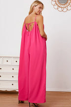 Women's ruffle trim tie-back cami jumpsuit with pockets, stylish and comfortable women’s apparel by Trendsi, shown full-length.