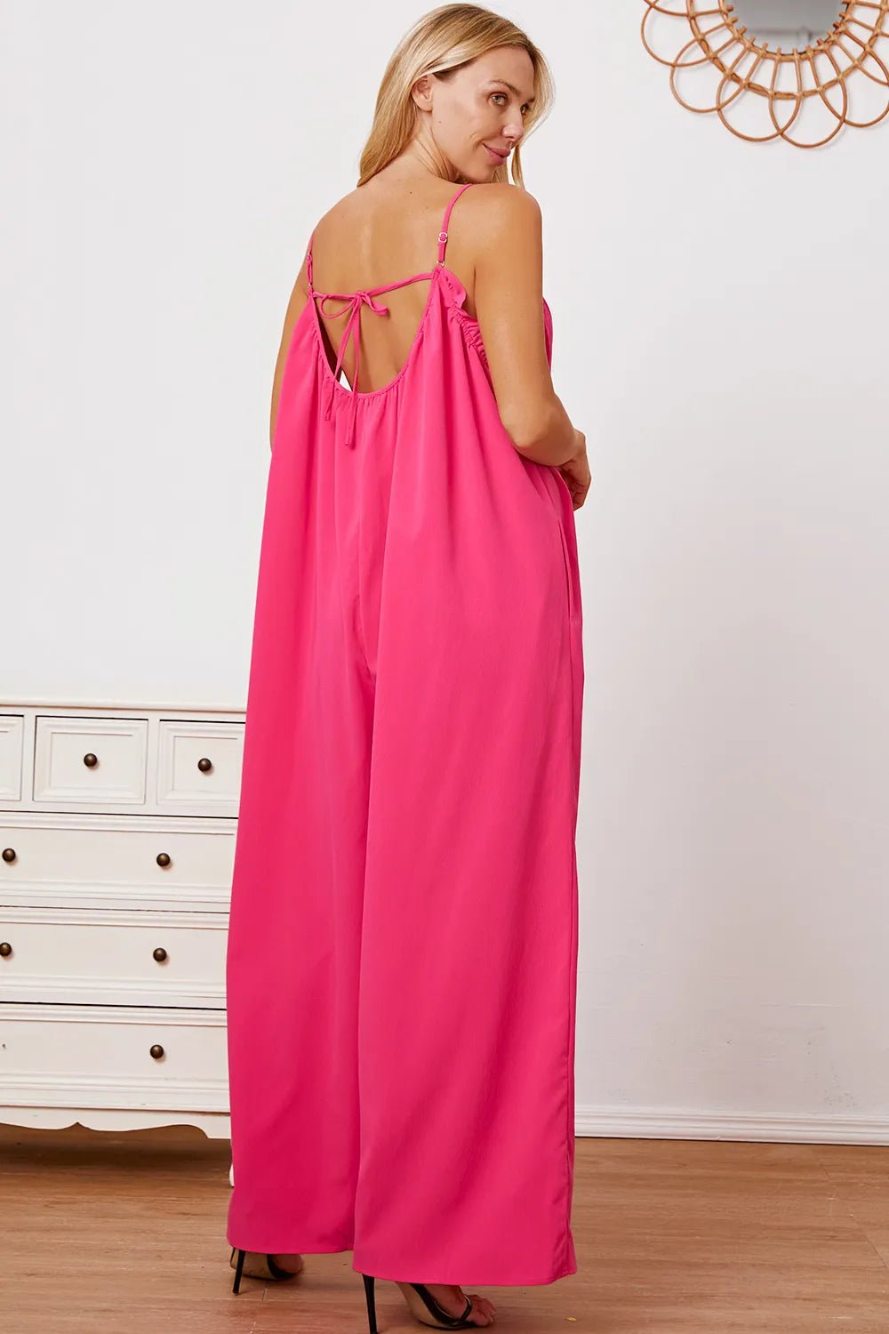 Women's ruffle trim tie-back cami jumpsuit with pockets, stylish and comfortable women’s apparel by Trendsi, shown full-length.