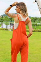 Women’s sleeveless V-neck wide leg jumpsuit with pockets, stylish and comfortable women’s apparel by Trendsi.