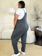 Women's sleeveless V-neck wide-leg jumpsuit with pockets, stylish and comfortable women's apparel by Trendsi.